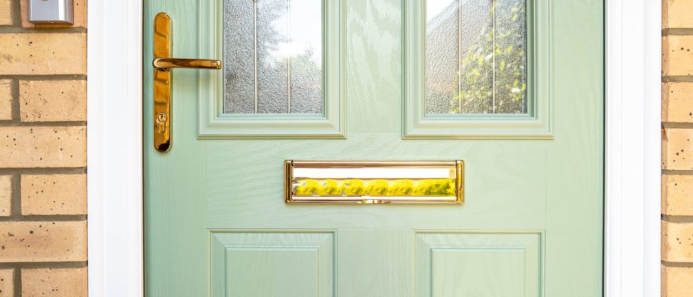 A green composite door for a home in South London.